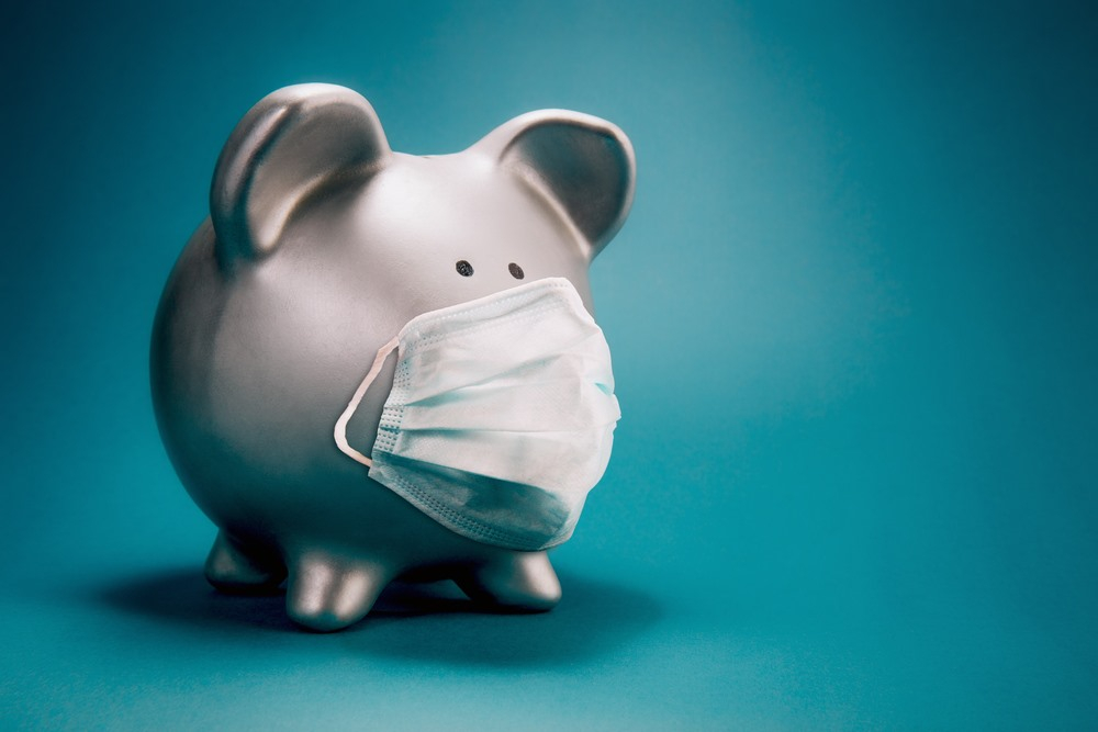Piggy bank wearing a protective mask.
