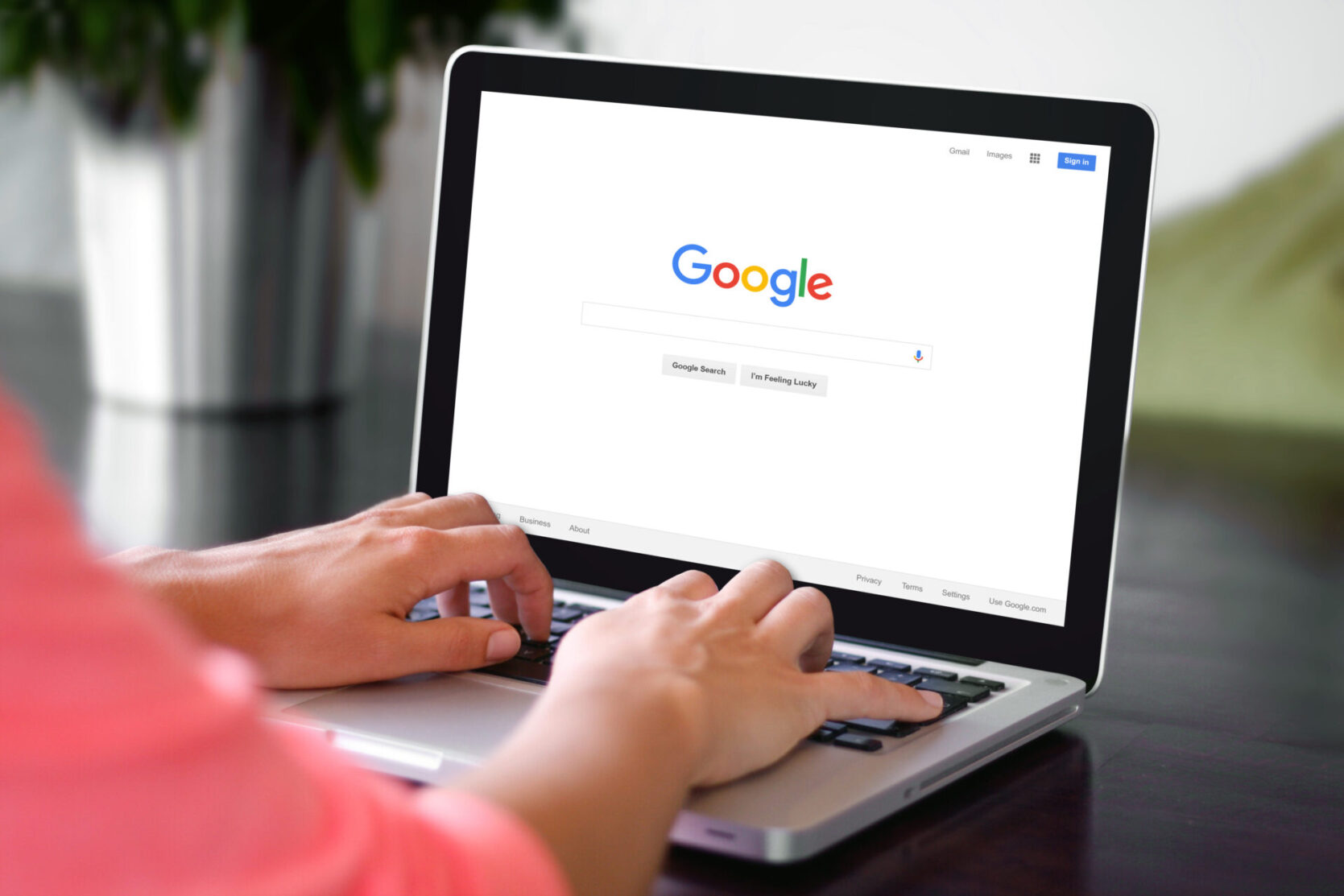 woman searching google on laptop