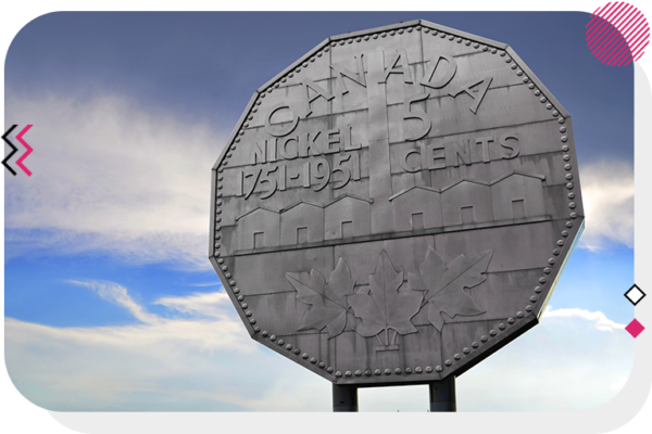 A massive billboard in the shape of a Canadian nickel
